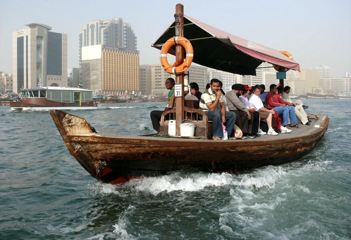A wooden abra crossing Dubai Creek